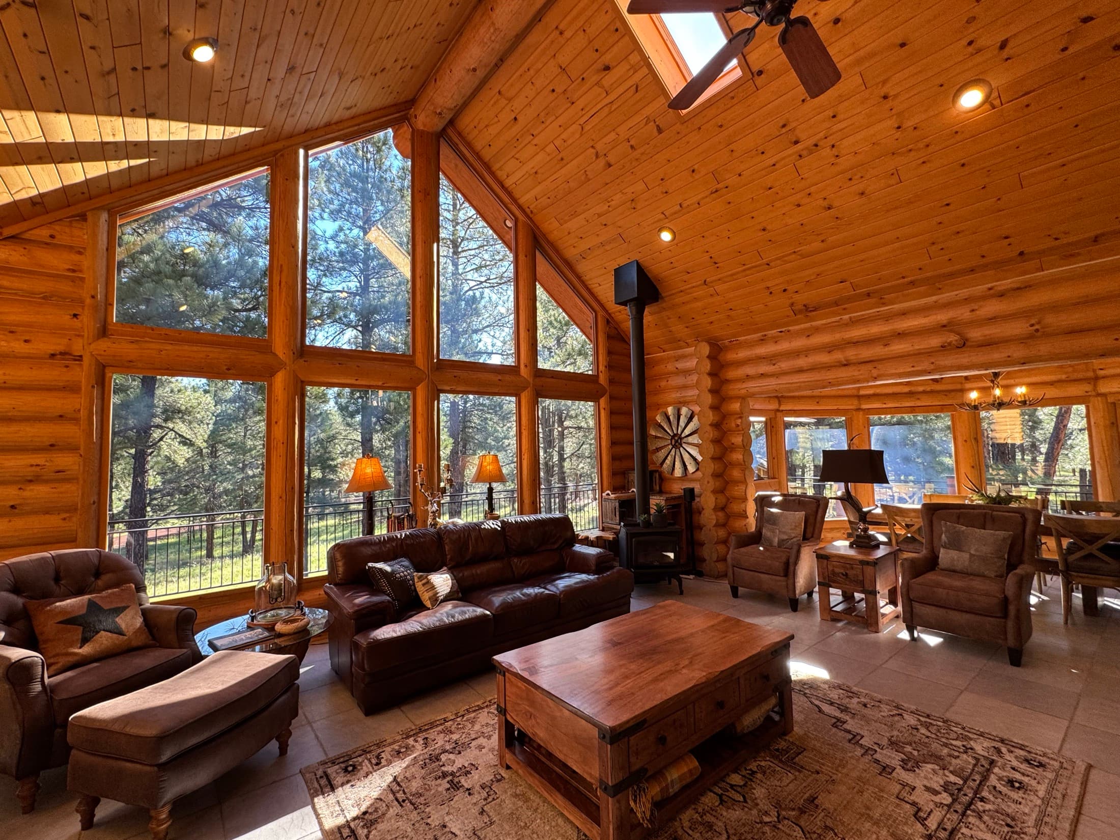 The cabin's great room with vaulted ceilings and mountain views