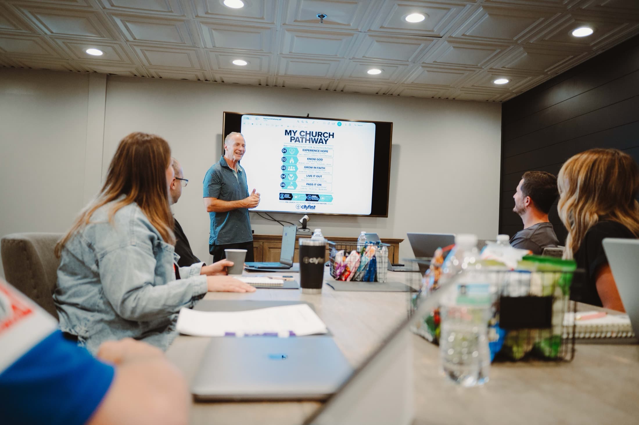 Mike Bodine presenting to a circle of leaders