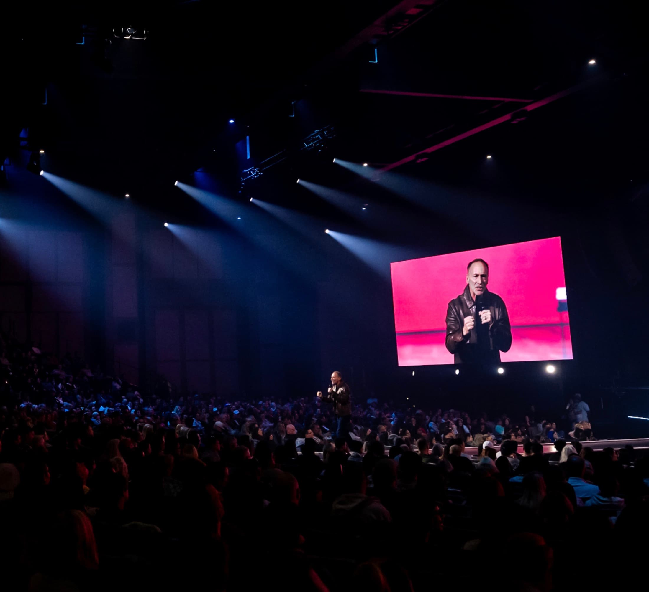 Mike Bodine teaching on stage to a large audience