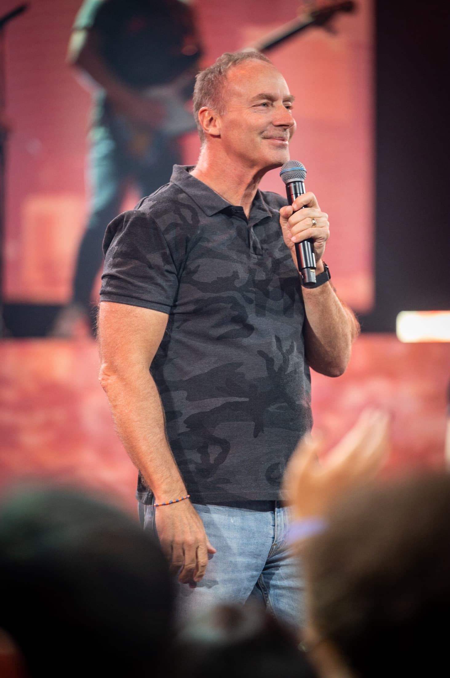 Mike Bodine speaking with a microphone